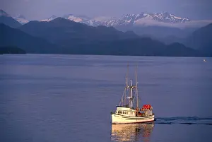 Se Alaska Prints: NA, USA, Alaska, Sitka, A fishing boat returns to Sitka; Baranof Island behind