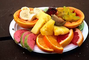 NA, USA, Hawaii. A fruit plate: Pappaya, fig, orange, pineapple, bannana, guava, star fruit