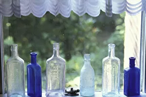 NA, USA, Kentucky Antique bottles in window