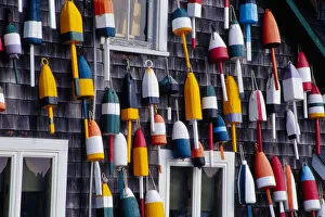 NA, USA, Maine. Bouys on side of building in the town of Bernard