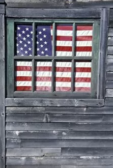 Images Dated 11th March 2004: NA, USA, Maine, Georgetown Island. Flag of the United States in window of abandoned store