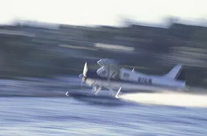 NA, USA, Washington, Seattle Float plane taking off from Lake Union