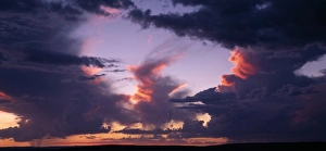 Namibia, Fish River Canyon National Park, Setting sun lights clouds of afternoon