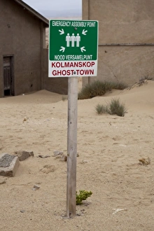 South Coast Prints: Namibia, Namib Desert, South Coast, Kolmanskop. Emergency assembly point sign in