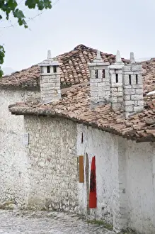 Citadel Prints: Narrow cobble stone street with traditional ottoman white stone houses. An Albanian