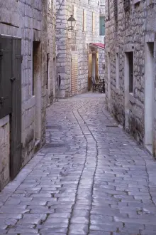 Cobbled Prints: Narrow cobbled roadway in a residential area of Stari Grad. Hvar Island. Croatia