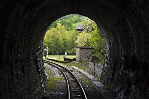 Narrow-gauge heritage railway track for the Sargan Eight train running through a tunnel