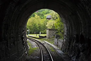 Narrow-gauge heritage railway track for the Sargan Eight train running through a tunnel Narrow-gauge heritage railway track for the Sargan Eight train running through a tunnel