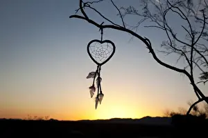 Copy Space Prints: Native American heart shaped dreamcatcher at early morning sunrise
