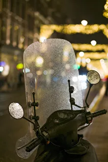 World Locations Prints: Netherlands, Amsterdam, Utrechtstraat street, motorbike and Holiday decorations, evening