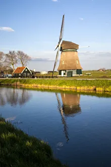 Images Dated 19th April 2012: Netherlands, Lisse, Windmill on a Canal