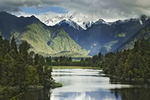 New Zealand, South Island. Cloud-shrouded Mt. Cook as seen from Lake Matheson near