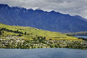 New Zealand, South Island, Queenstown. Landscape of city, mountains, and Lake Wakatipi