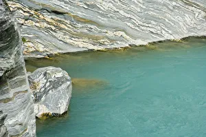 Images Dated 15th February 2007: New Zealand, South Island, Westland National Park. Water polished sedimentary rock