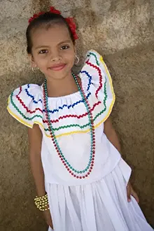 Nicaragua, Granada. Girl in traditional dress after dance in Villa Esperanza barrio. (MR)