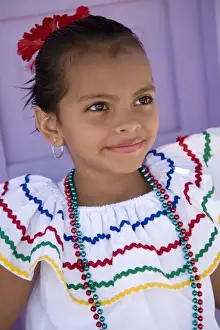 Images Dated 2nd November 2008: Nicaragua, Granada. Girl in traditional dress after dance in Villa Esperanza barrio. (MR)