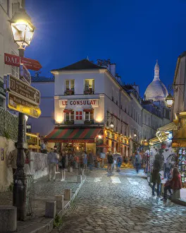 Night street scene in Montmartre district in Paris, France