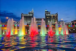 Cityscape Prints: Night view of fountain in Round Square and the Headquarters of KazMunayGas, Astana