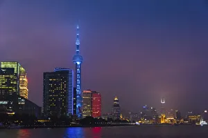 Night view of Oriental Pearl TV Tower and high-rises by Huangpu River, Pudong, Shanghai