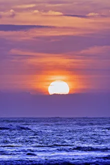 Images Dated 5th January 2023: Nightly ritual when tourists gather to watch the amazing sun setting over the Indian Ocean at Pererenan Beach
