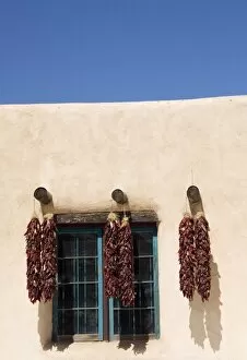 NM, New Mexico, Taos, shop fronts at Taos Plaza, with chile ristras