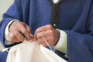 Mature Prints: North Africa, Morocco, Fes, Medina craftsmen sewing