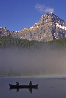 Images Dated 9th July 2010: North America, Canada, Alberta, Baniff National Park. Silhouette of two boys in