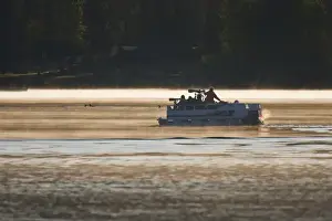 North America, Canada, British Columbia near Kamloops, wildlife photographers on pontoon