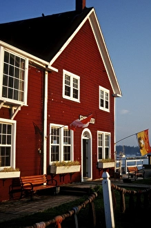 North America, Canada, New Brunswick, St Andrews. A bright red building on the harbor