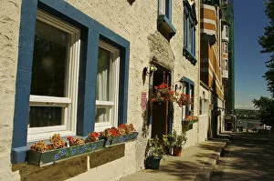 Images Dated 20th August 2007: North America, Canada, Quebec, Old Quebec City. Flowers decorate an old stone building