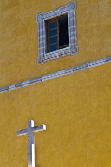 Images Dated 27th December 2011: North America, Mexico, Guanajuato. White cross against a yellow church wall with