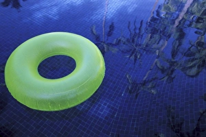 Ie Inhouse Scan Prints: North America, Mexico, Jalisco, Puerto Vallarta. Green innertube in hotel pool