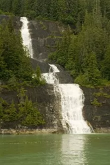 Images Dated 25th July 2006: North America, USA, AK, Inside Passage. Waterfall through forest cascades down cliff