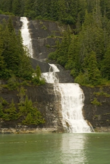 Images Dated 25th July 2006: North America, USA, AK, Inside Passage. Waterfall through forest cascades down cliff