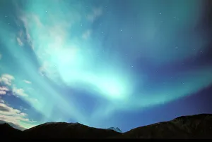 Images Dated 2nd August 2006: North America, USA, Alaska, Brooks Range. Brilliant green aurora borealis lights up clouds