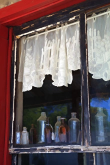 Images Dated 7th October 2011: North America, USA, Georgia; Savannah; Colorful old bottles in window of an old building