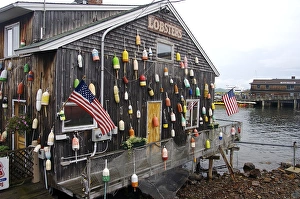Buoy Prints: North America, USA, Maine, Bar Harbor. A seafood restaurant on the water decorated