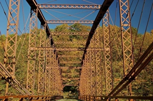 Images Dated 21st October 2007: North America, USA, Massachusetts, Shelburne. A bridges colors blend with the fall scenery