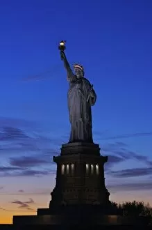 Images Dated 10th November 2006: North America, USA, New York, New York City. The Statue of Liberty at sunset