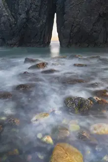 Images Dated 2nd June 2015: North America, USA, Oregon. Slow shutter speed of ocean spray over lichen covered rocks at arch