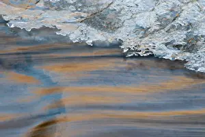 North America, USA, Utah. Abstract frozen ice pattern and waters of Mill Creek, Moab, UT