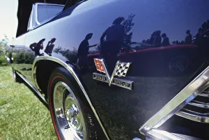 North America, USA, Washington, Everett. Reflection of 1997 Chevrolet Stingray in North America, USA, Washington, Everett. Reflection of 1997 Chevrolet Stingray in