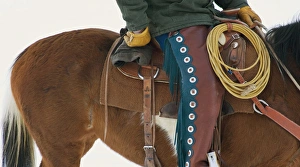 Images Dated 20th May 2007: North America; USA; Wyoming; Shell; Cowboy on Horse wearing Leather Chaps; (MR)