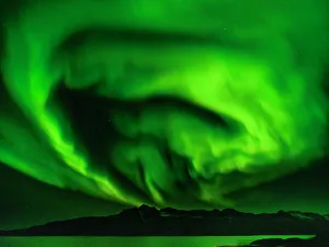 Images Dated 7th October 2022: Northern lights over Angmagssalik Fjord near settlement Kuummiit
