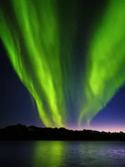 Images Dated 23rd June 2022: Northern lights over Angmagssalik Fjord near settlement Kuummiit (formerly spelled Kummiut)