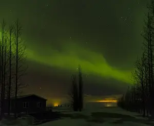 Mystical Prints: Northern Lights or aurora borealis over Laugardalur during winter in Iceland. europe
