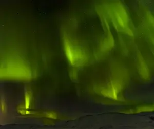Dark Prints: Northern Lights or aurora borealis over the mountains between Thingvellir and Laugarvatn