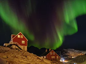 Aurora Prints: Northern Lights over the town. Town Tasiilaq (formerly called Ammassalik)