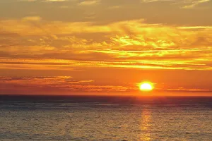 Norway, Finnmark, Loppa. Midnight sun over the Norwegian sea