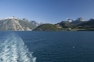 Images Dated 4th July 2009: Norway, Geirangerfjord (UNESCO), Geiranger. Picturesque summer fjord view with ship wake